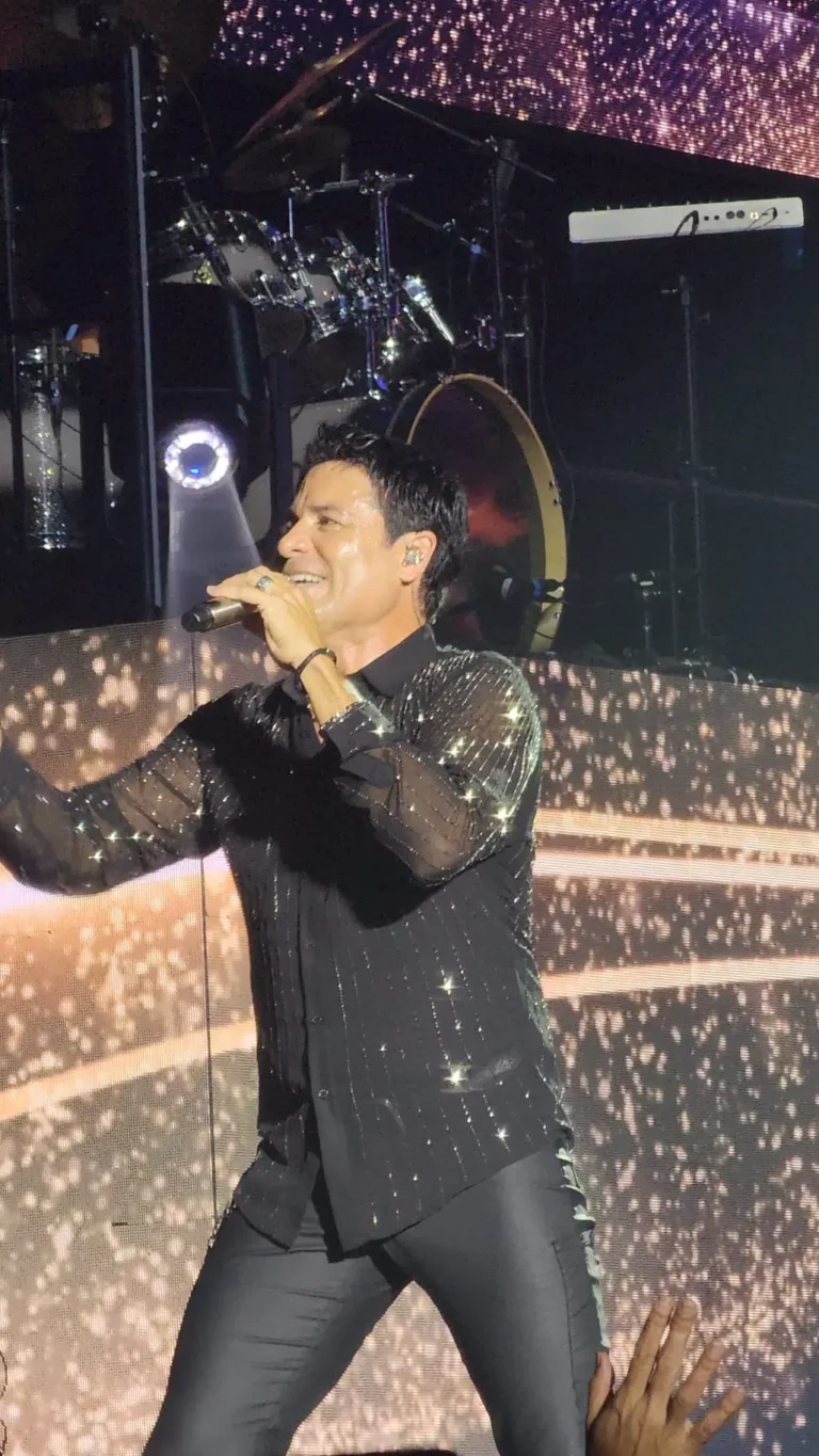 a man singing into a microphone